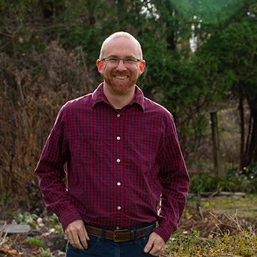 A photo of Professor Loren Byrne standing outside 