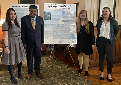 Students and faculty pose with their research